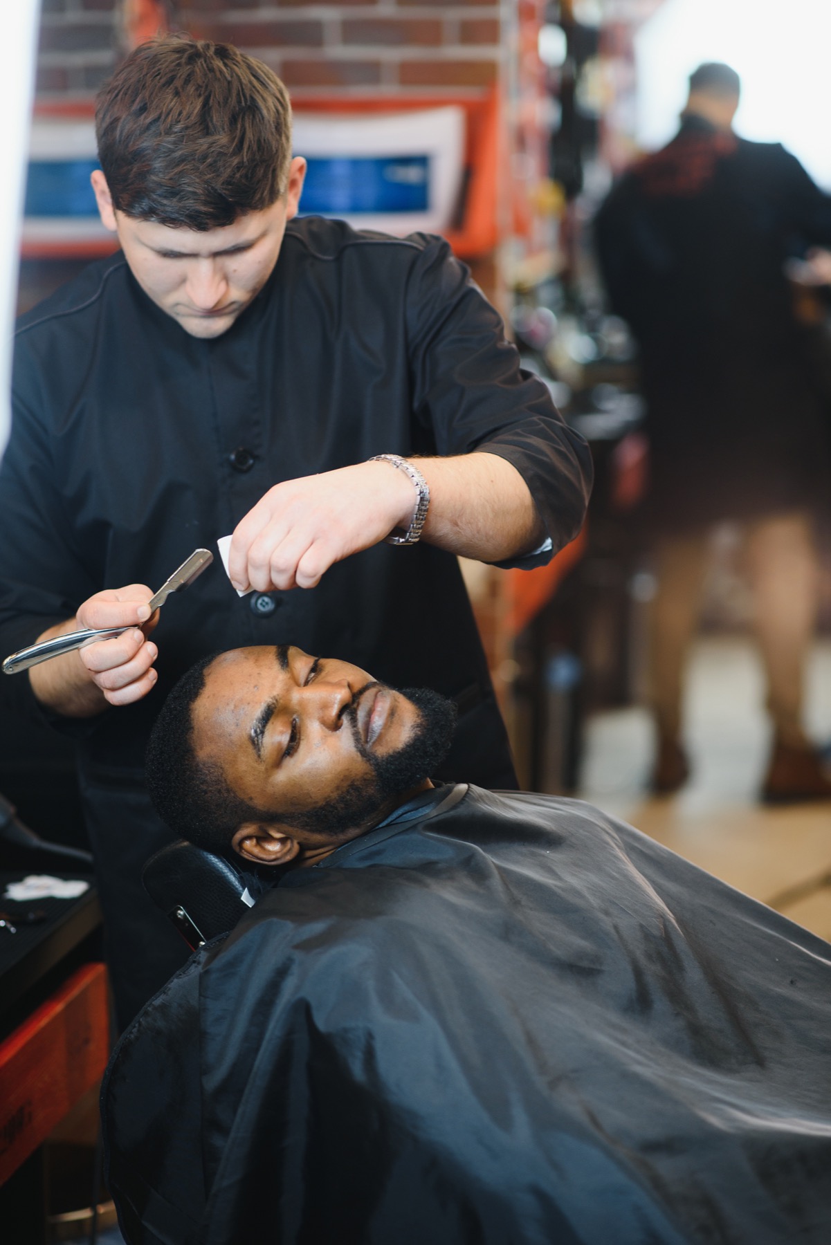 Straight razor detail during a precision grooming service.